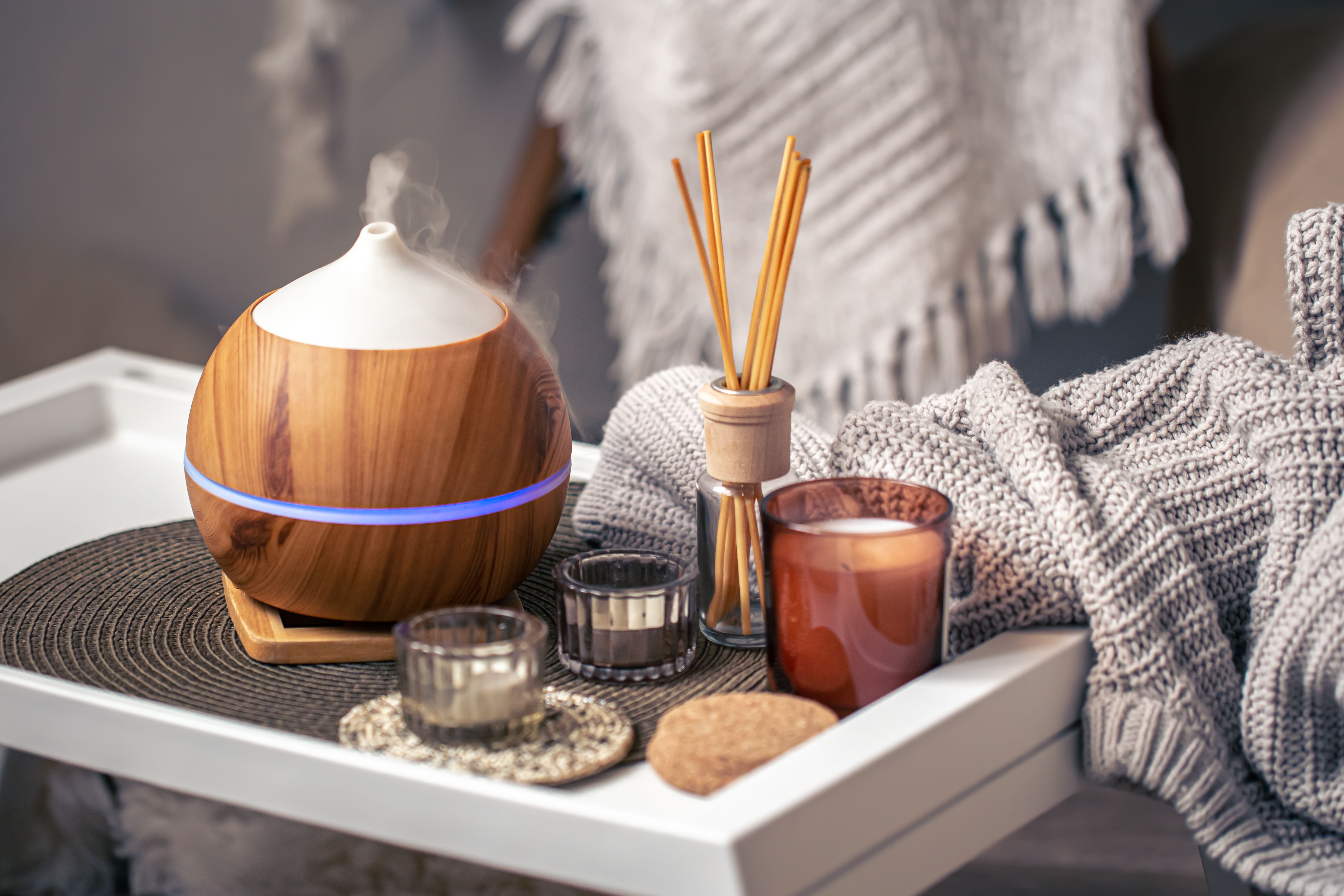 cozy-composition-with-aroma-diffuser-candles-home-interior.jpg